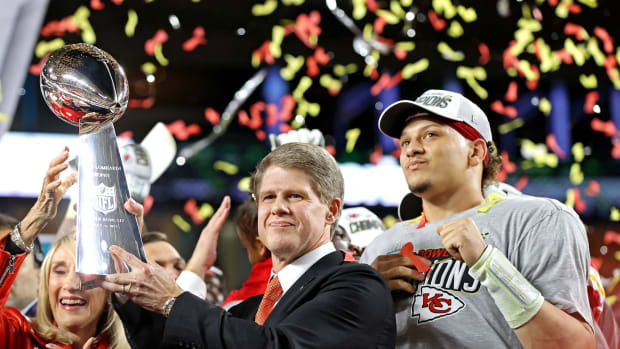 Feb 2, 2020; Miami Gardens, Florida, USA; Kansas City Chiefs owner Clark Hunt and Kansas City Chiefs quarterback Patrick Mahomes (15) celebrate with the Vince Lombardi Trophy in Super Bowl LIV at Hard Rock Stadium. Mandatory Credit: Matthew Emmons-USA TODAY Sports